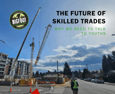 A young skilled worker overlooking a crane being commissioned following the guidance of a professional and educational setting